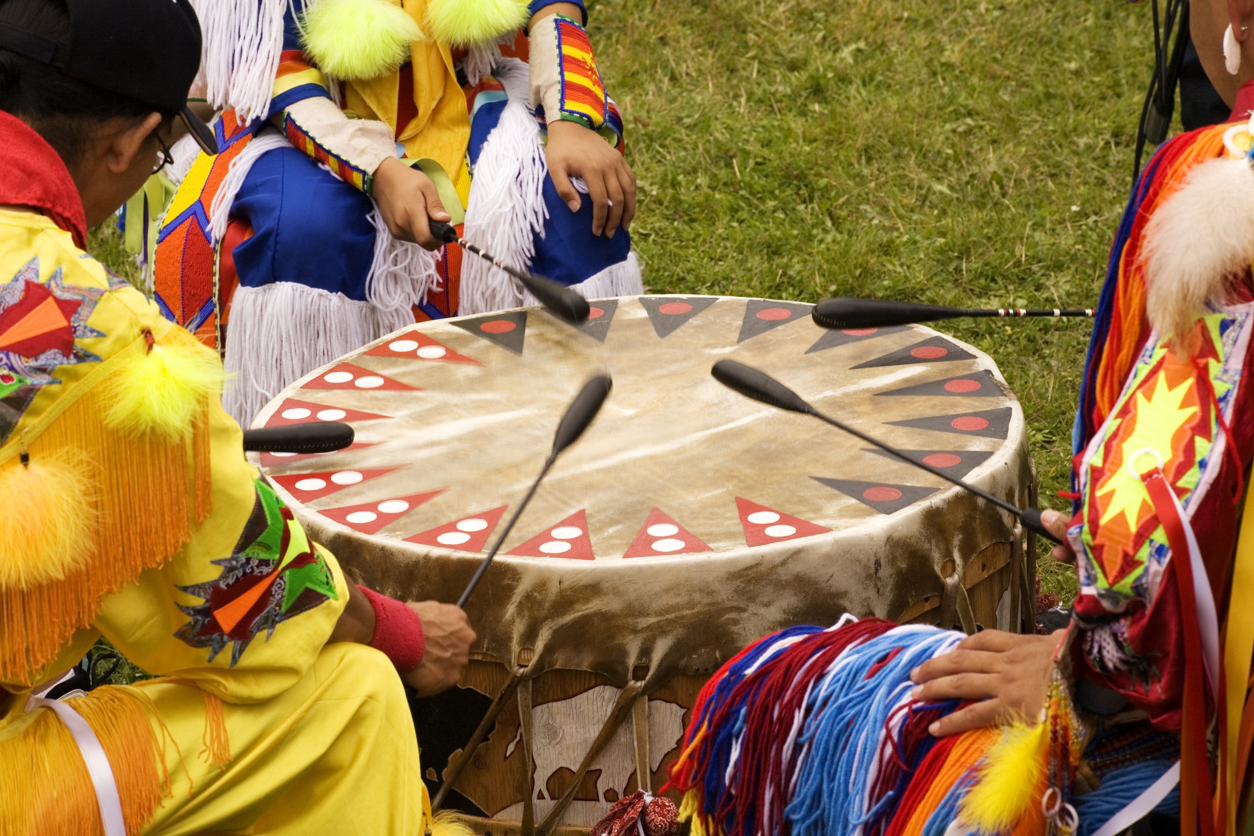 Indians around a drum at a Pow Wow Indians drumming